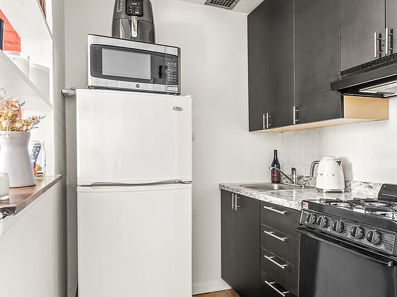 3rd image of 227 E 12th St APT 3B