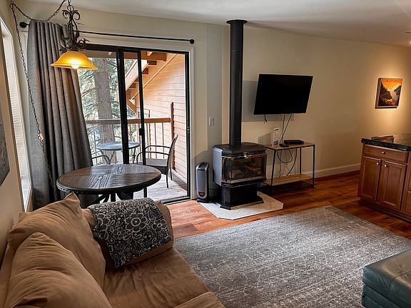 Living area with exterior deck and gas fireplace