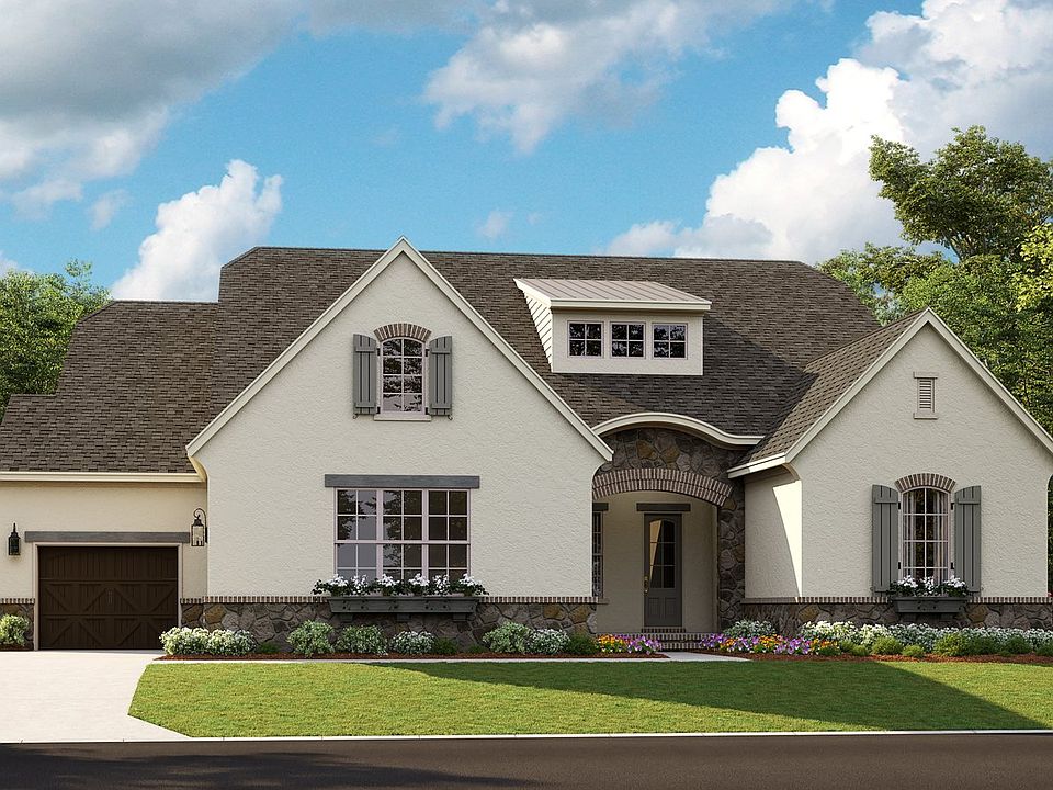 Santa Fe - French Cottage 3-Car Side Load Garage Note Renderings may show optional features