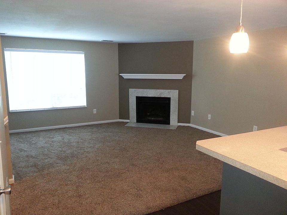 Living room with wood burning fireplace