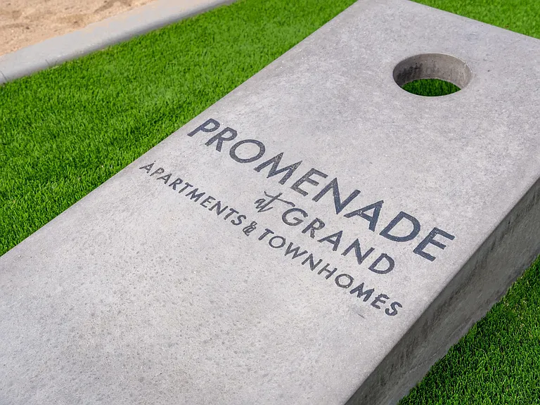 Join the fun with a game of cornhole while the kids enjoy the neighboring playground.