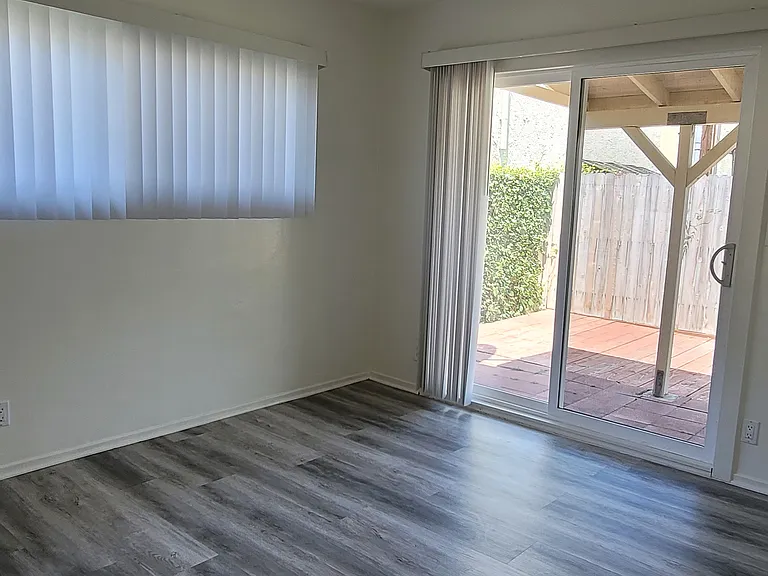 2nd bedroom leading to outside patio yard