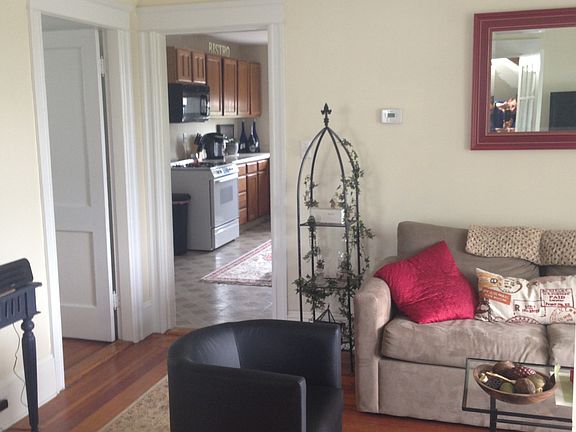 view from living room. Bedroom door is on the left, kitchen is straight ahead.