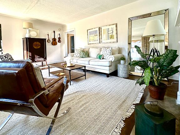 Living Room, hardwood flooring, fireplace, white paint