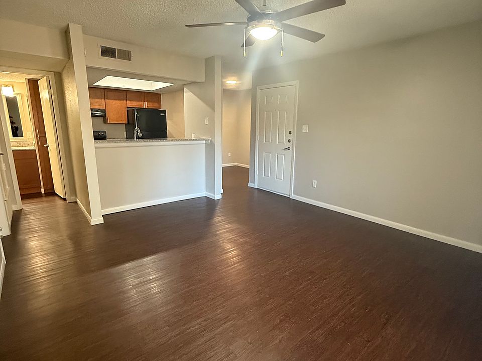 Spacious living room facing the beautiful kitchen