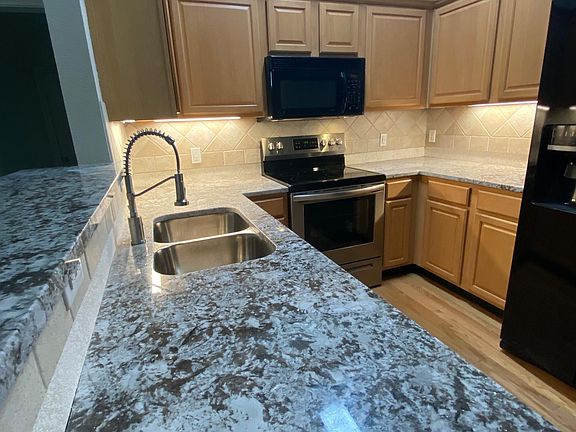 New Granite counter tops with custom sink and faucet.