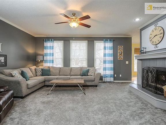 Wall of windows in the family room has great view of treed backyard!