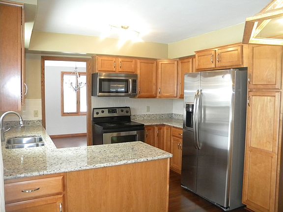 kitchen also has stainless steel appliances and subway tile backsplash