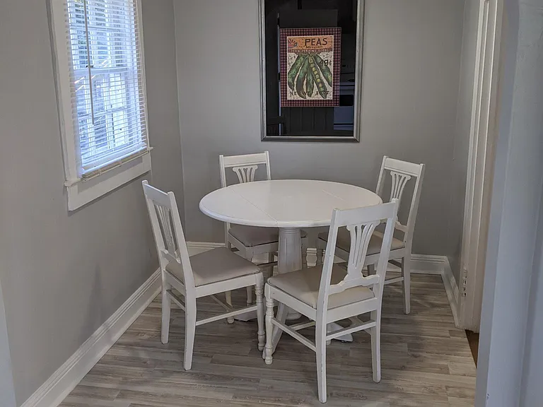 Dining area opens off both kitchen and hall.