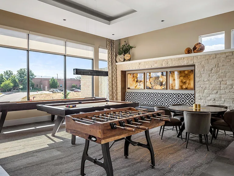 Game Room with Foosball Table and Multiple Seating Areas