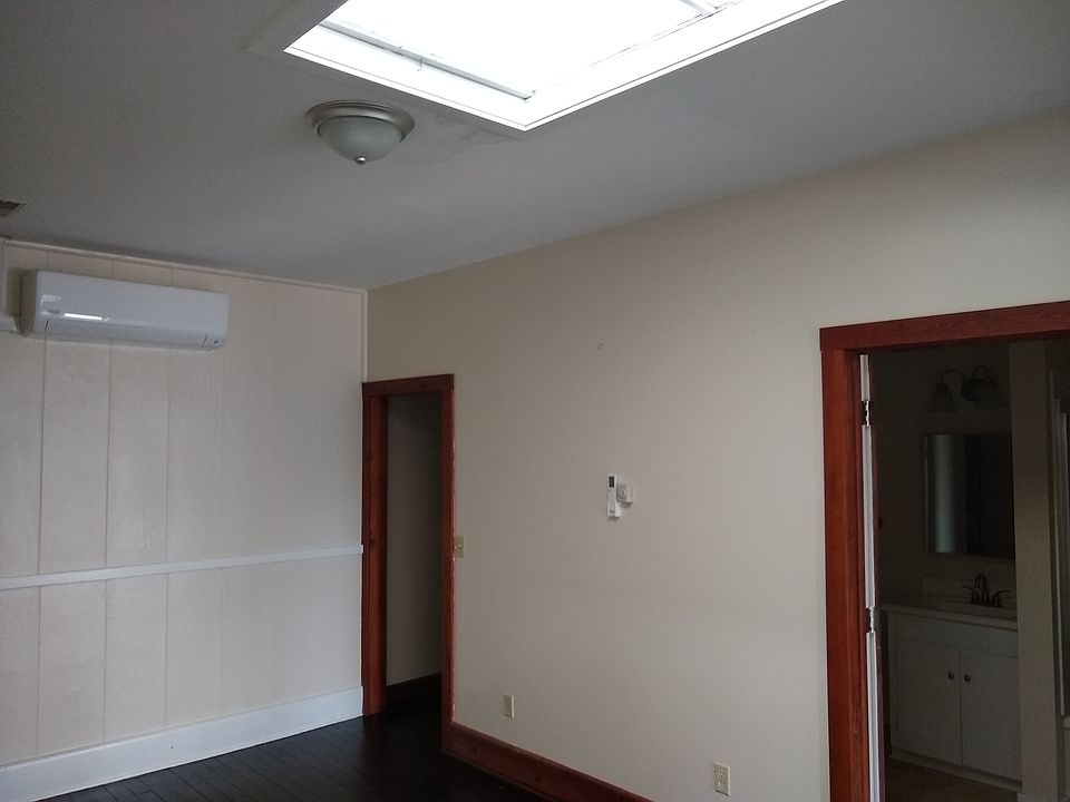 Living room - note the widows watch on the ceiling, letting in the natural light.