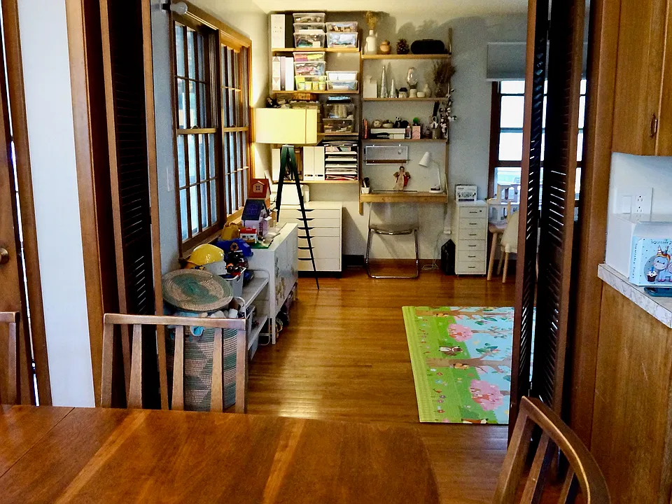 Dining room looking into den area