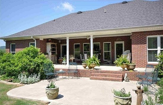 Awwww....the back porch and patio!
						:
						Unwind and entertain....great space with nice view
