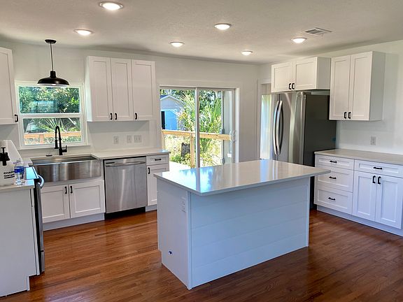 Kitchen with entry to laundry and back yard