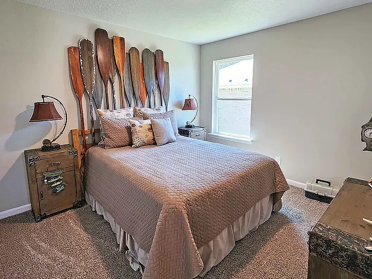 This bedroom looks out to the side yard.
