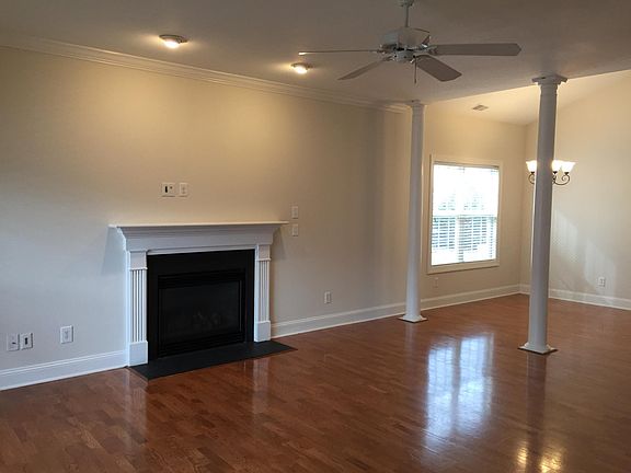 Family room has a fireplace with gas logs and is open to dining room