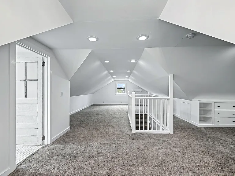 Third Floor bonus room with built in shelves - showing entry to full bathroom