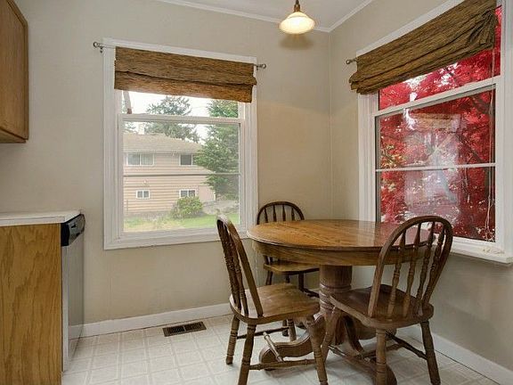 Dining area in kitchen has lots of natural light!