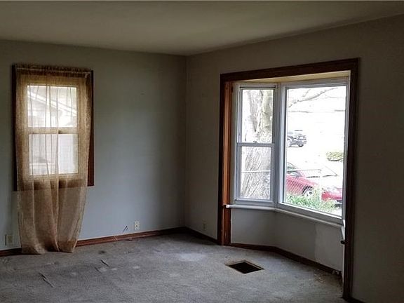 Another look at the living room with the bow window...plenty of natural light