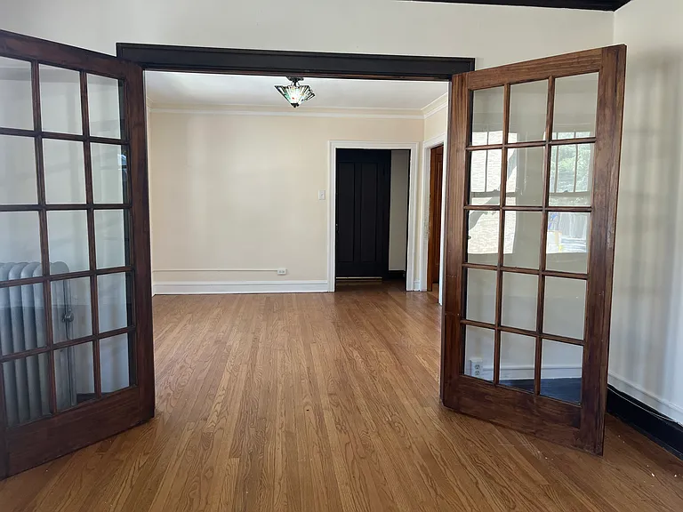 Formal Living Room could be Bedroom #2 - View to Dining Room or your new Family room (French Doors open here)