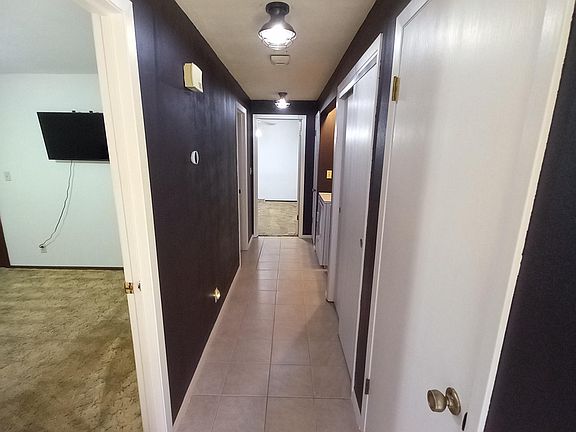Hall w/ washer/dryer in unit
