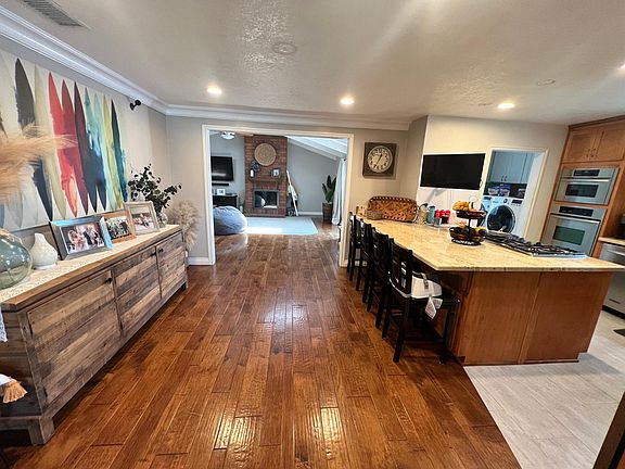 Kitchen with living room in distance