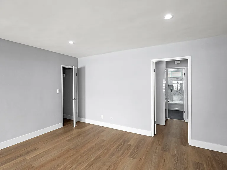 Bedroom with Vinyl Flooring and Bathroom