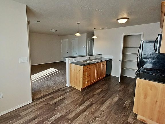 Kitchen with dining area and pantry storage