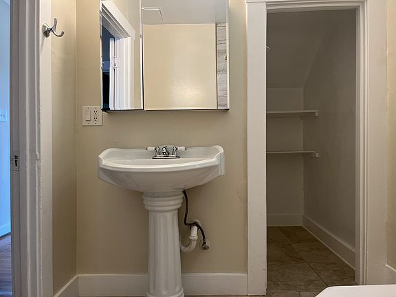 Ample storage space in bathroom 1