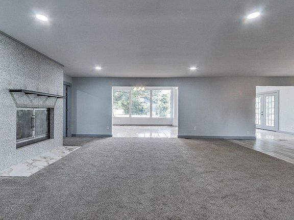 Living room with granite fireplace