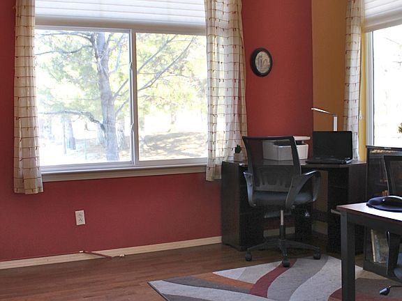 Main level office/bedroom is facing one of the walking trails within Palomino Park