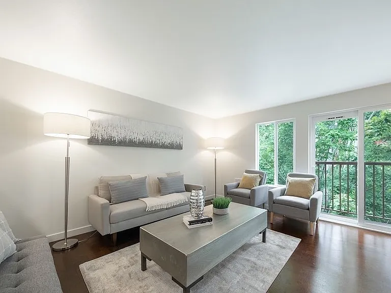 Beautiful natural light flowing through the oversized windows and sliding glass door (connected to the Juliet balcony- perfect for plants and bird feeders)