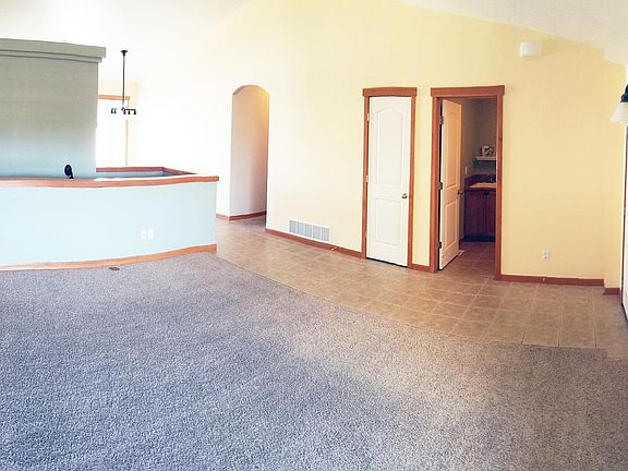 Living Room with Stairs to Basement