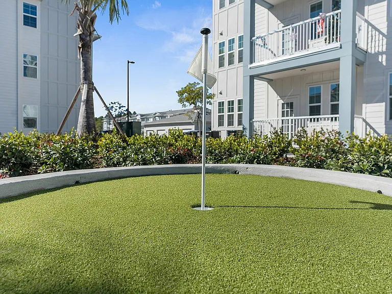 Enjoy leisure time at the apartment's well-maintained putting green, perfect for relaxation and fun.