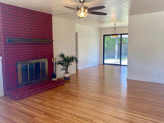 Come on in! Your freshly refinished oak hardwood floors are gleaming. It's hot now, but just imagine how warm and cozy you will be in the winter with a blazing fire in your REAL fireplace. For now, just cool off with that beautiful ceiling fan.