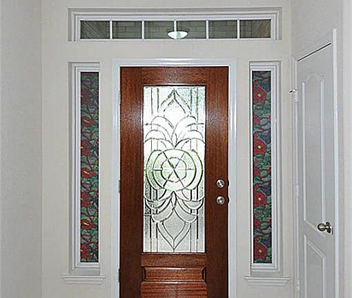 Gorgeous tiled entry way with impressive glass details.