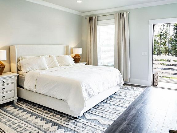 Primary suite with balcony overlooking the park