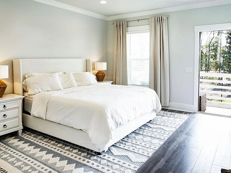 Primary suite with balcony overlooking the park