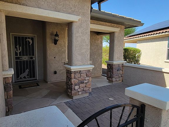 Paved front courtyard.