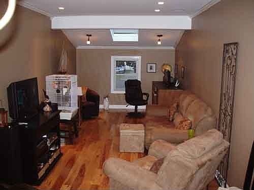 Family Room with Entertainment System and Skylight