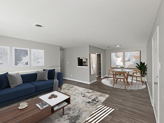 Spacious Living Room + Hardwood Style Flooring