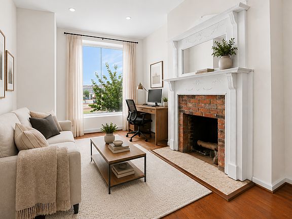 Front room staged as a living room/office