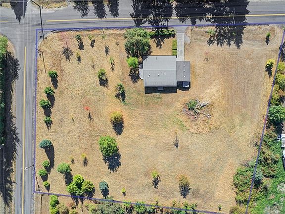 Plenty of space on this commanding lot to build your dream home, and use current residence while you build and then later as a potential ADU.