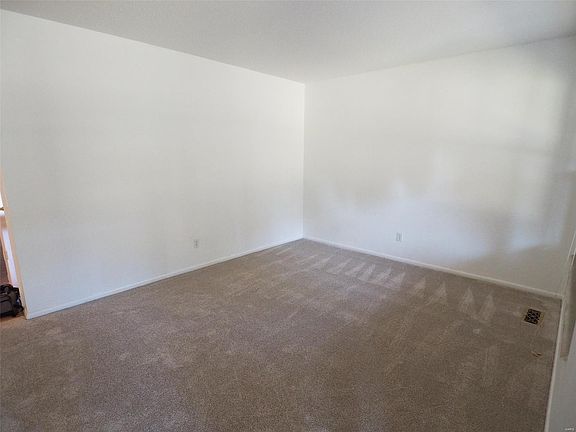 Open and Spacious Living Room with new carpeting, freshly painted (top to bottom)
