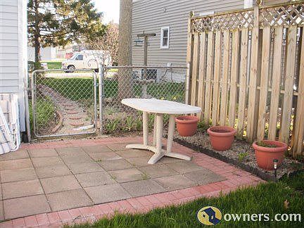 nice landscaping with paver/brick patio