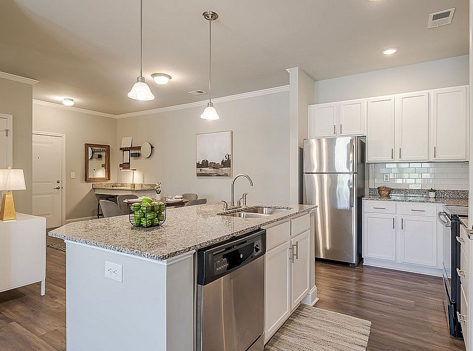 Experience the charm of this sleek kitchen, designed for culinary adventures and cozy dining moments.