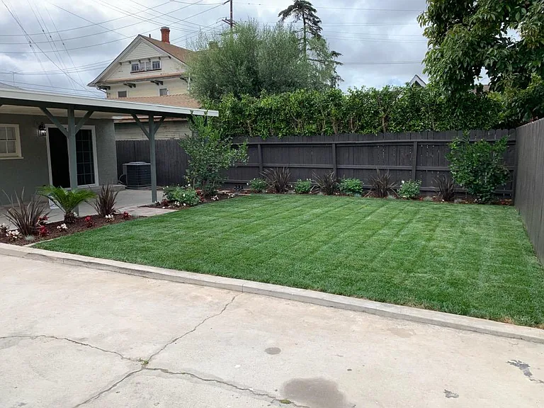 Private backyard. Covered carport shown to the left. Also shown is the direct access to master bedroom.