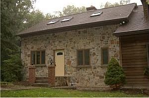Front left side of house with stone facing