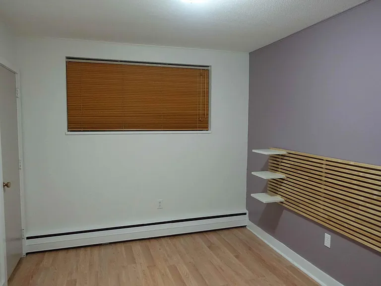 Bedroom, facing window and bedroom closet #1