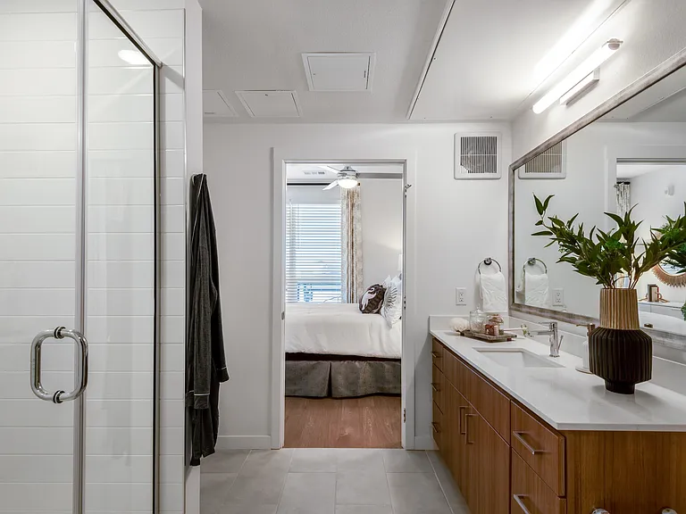 Modern Bathroom Featuring Walk-In Glass Shower and Double Vanity